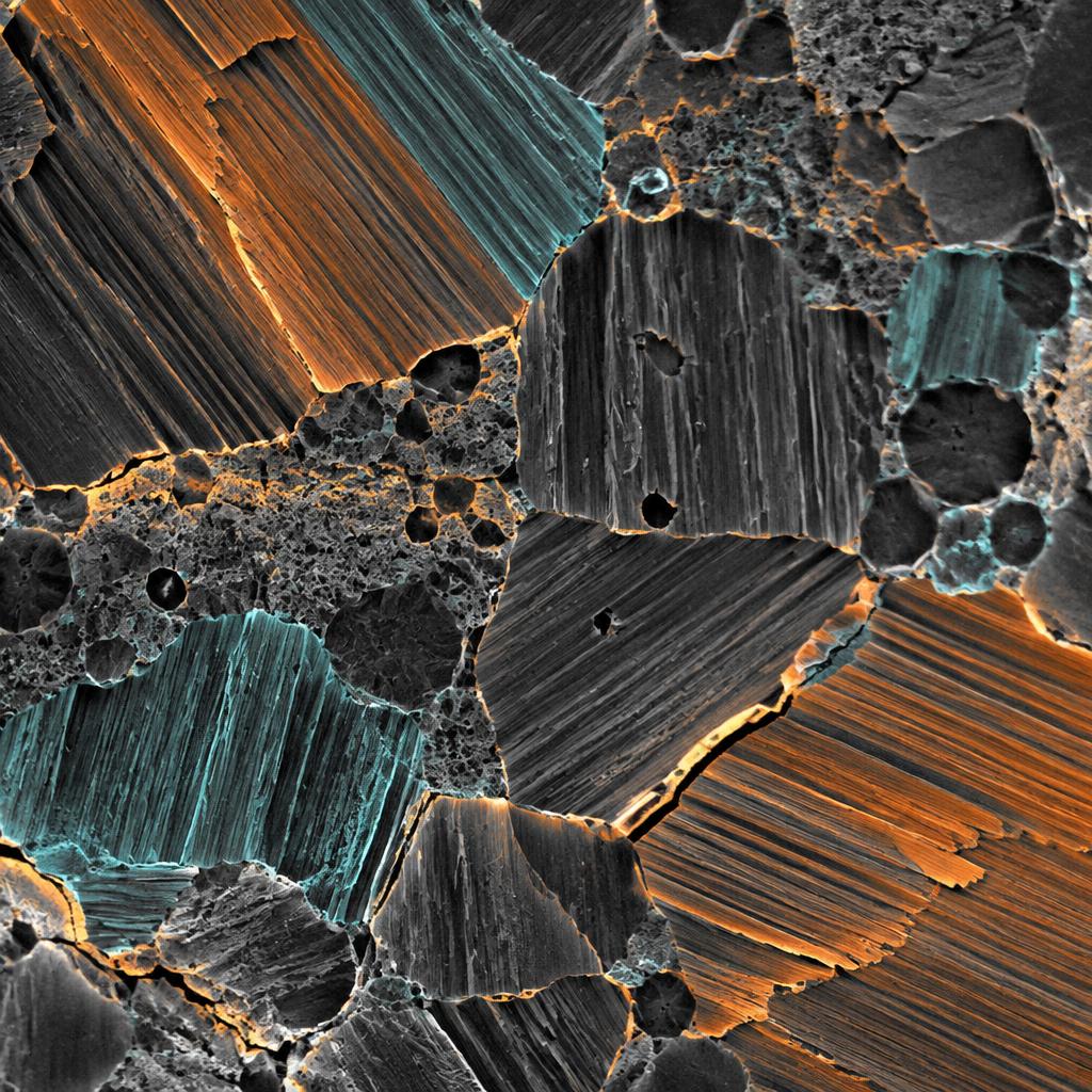 False-color microscopy image showing layered crystalline domains